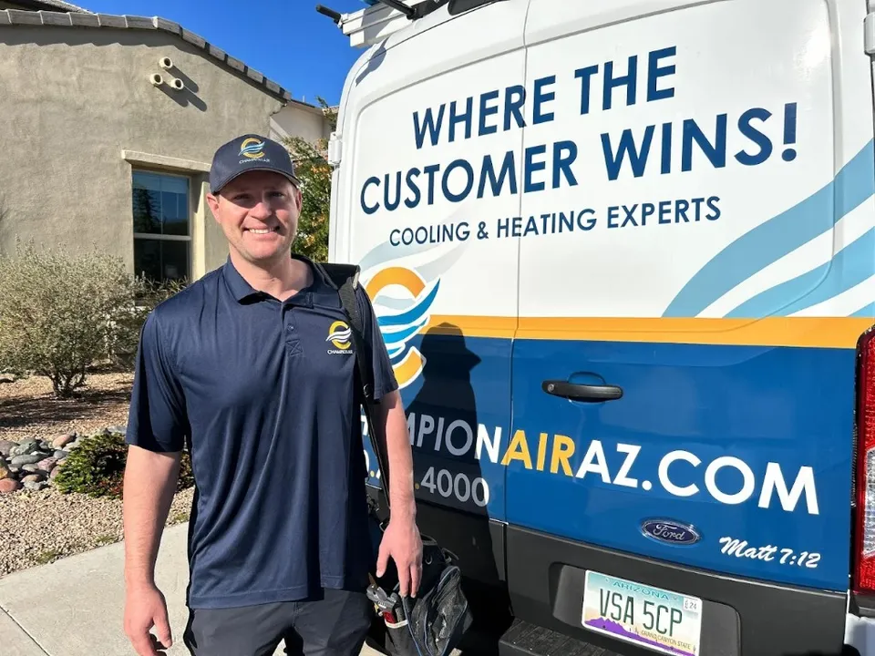 Zach, Champion Air technician, next to the branded service van