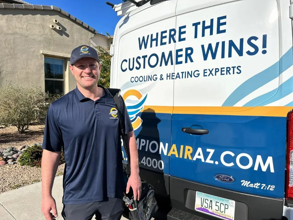 Zach, Champion Air technician, next to the branded service van